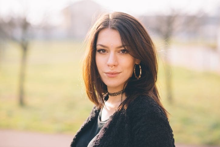 brunette woman somber outside