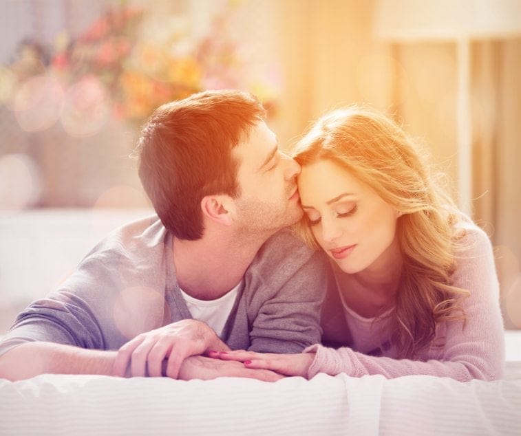 Young couple laid thoughtful