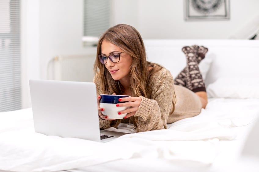 Woman looking at laptop