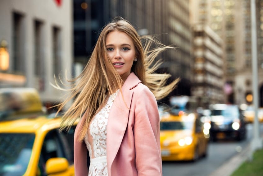 Blonde girl with flyaway hair in New York City street