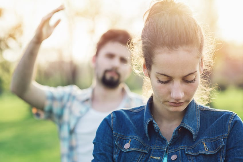 couple arguing sad field sun