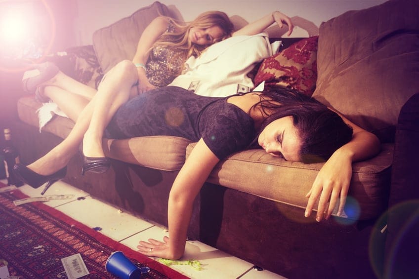 Two girls laid sofa drunk