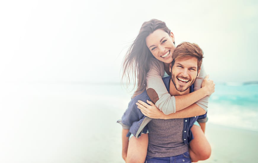 Young couple piggy back
