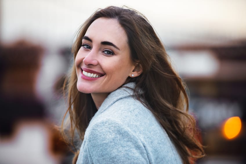 woman smiling portrait sunset