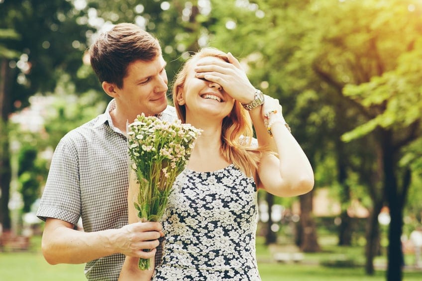Couple being surprised with flowers