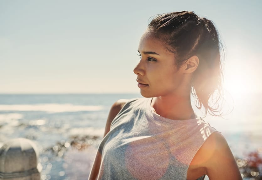woman fitness sun beach water
