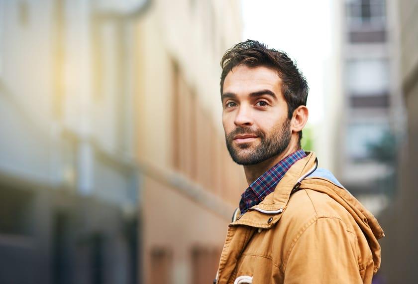 Cropped shot of a young man commuting through the city
