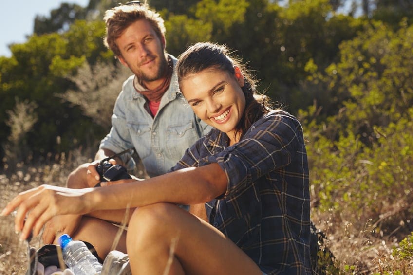 couple happy hike sun