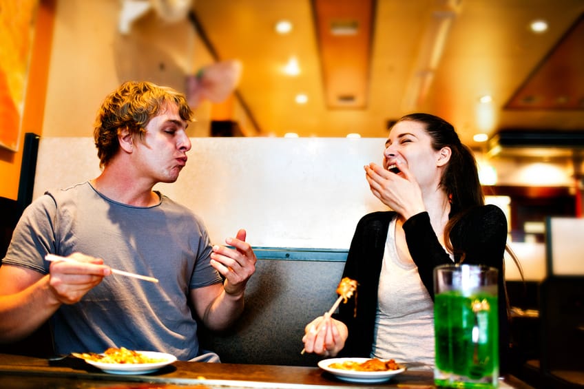 happy couple date restaurant laughing