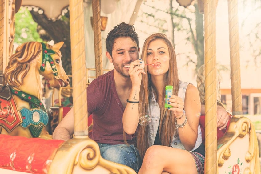 couple carnival carousel bubbles summer happy