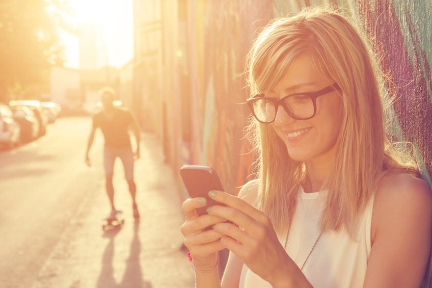woman phone sunlight summer outside texting