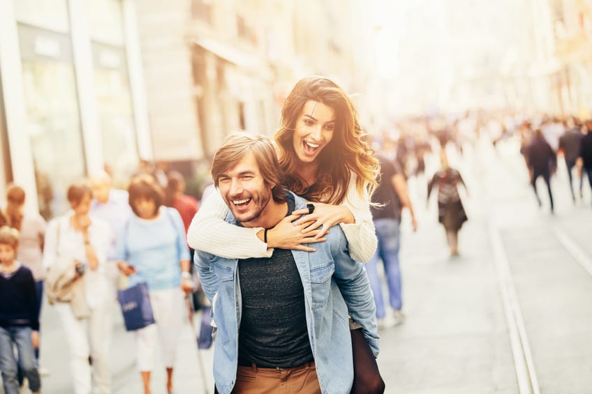 Couple having fun piggy back