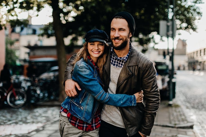 Close up of a happy young couple enjoying city life.