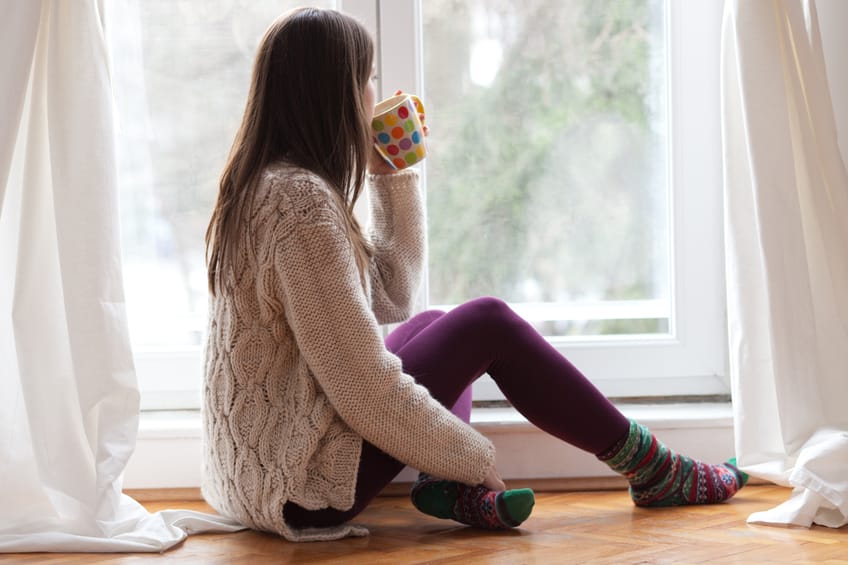 woman tea window cozy home