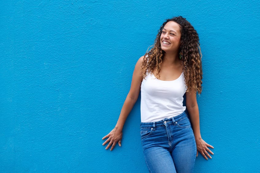 woman happy blue wall portrait