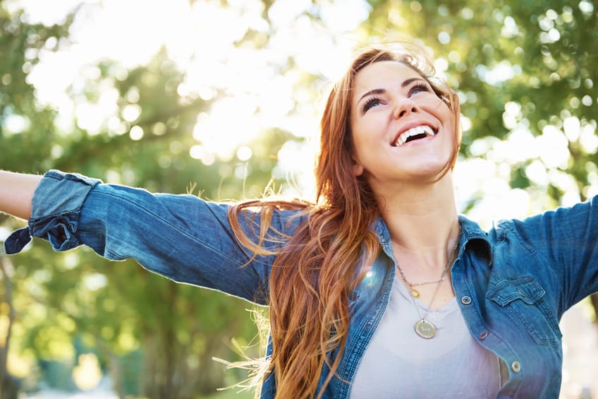 young woman happy outdoors park