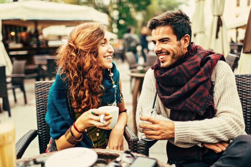 A happy couple enjoying the day at the cafe.
