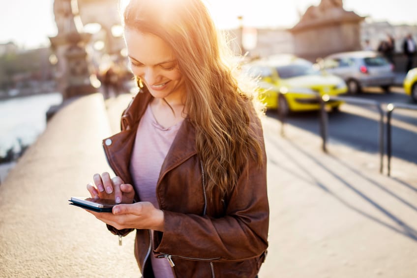 woman texting city sunshine