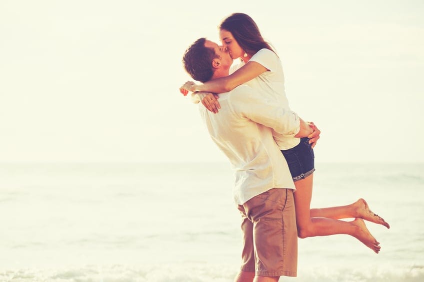 Young Romantic Couple Playing on the Beach.