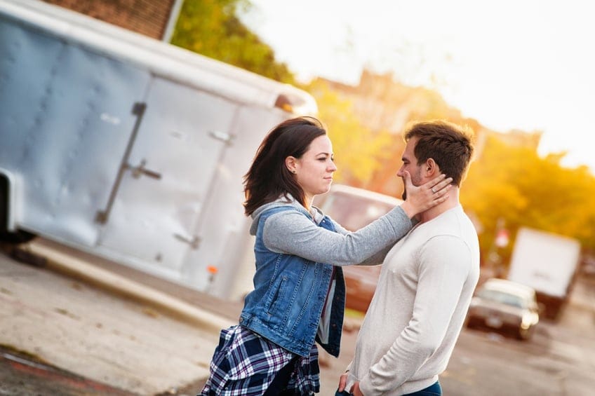 Compassionate young woman consoling her male friend
