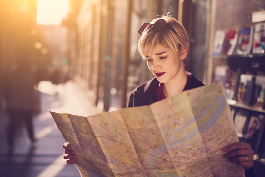 young woman map travel adventure