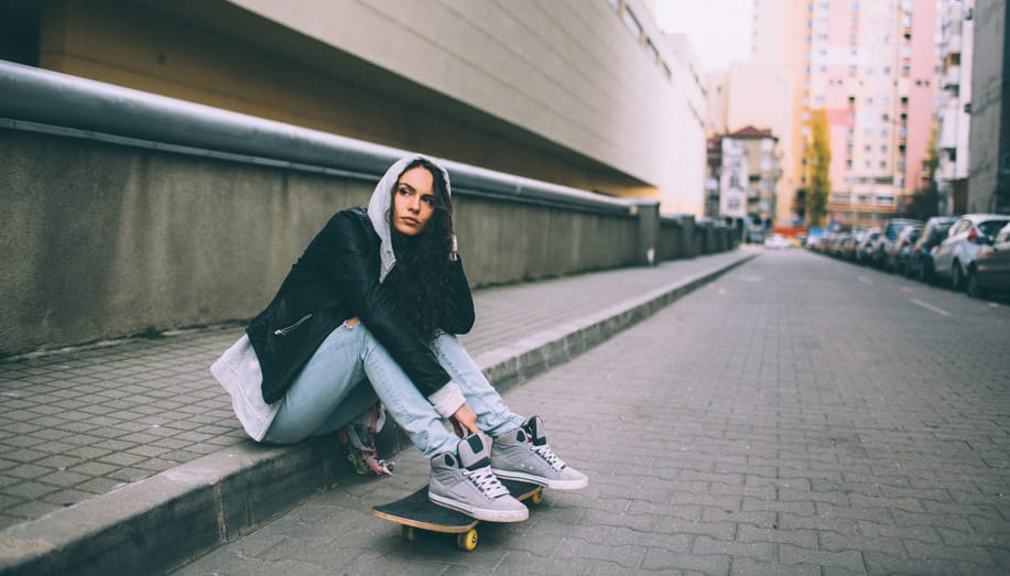 woman skateboard sad outdoors