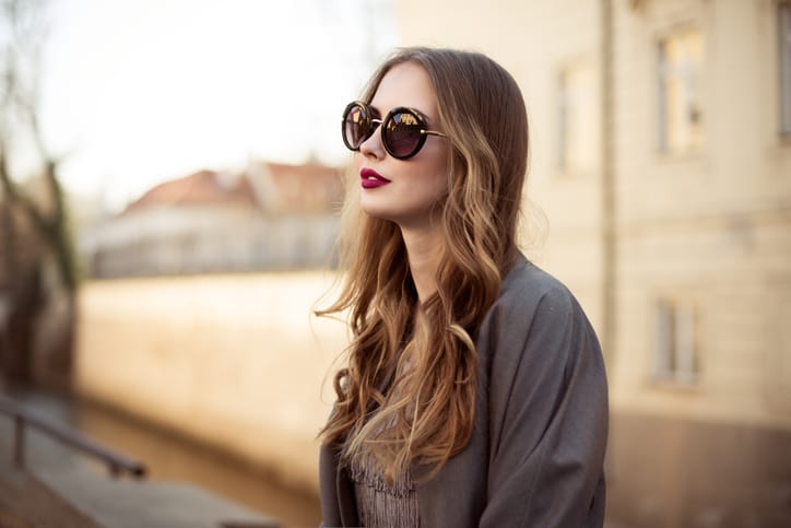 woman sunglasses outdoors serious