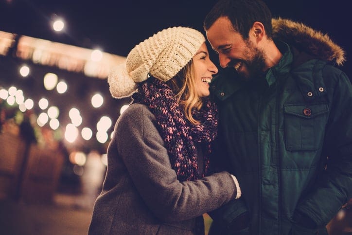 Romantic couple sharing their affection on Valentine's day, while walking outdoors