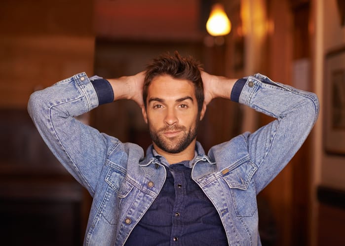 Portrait of a handsome young man wearing denim clothing