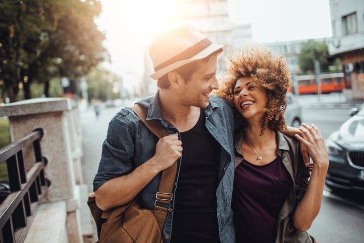Close up of a happy young couple enjoying city life.