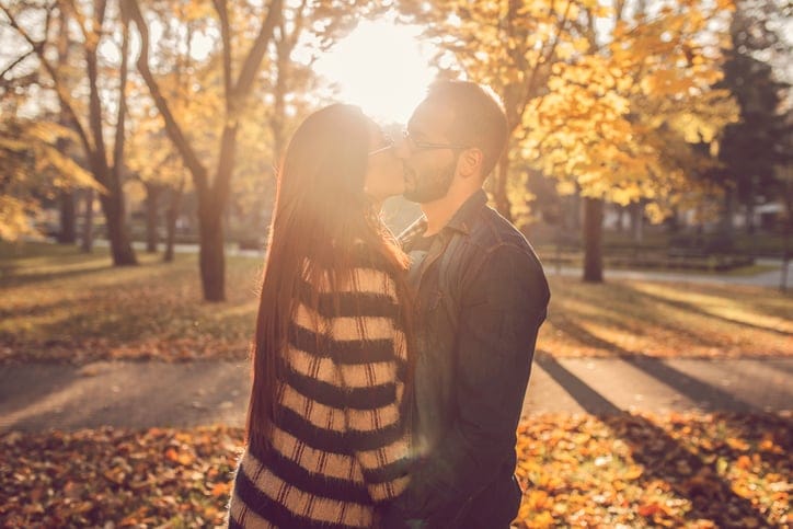Autumn sunset and sweet kiss