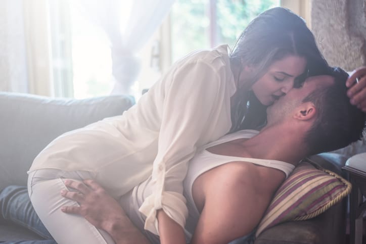 couple kissing bed passion romance sex