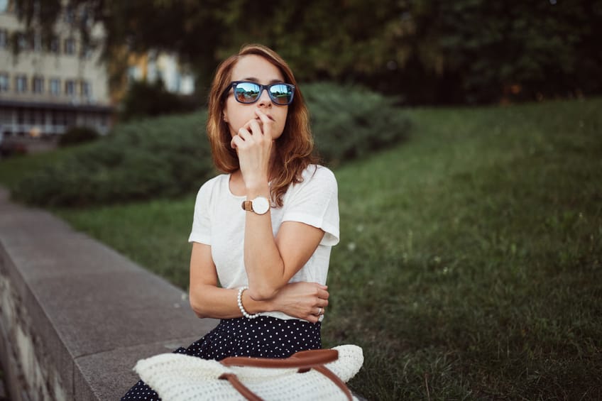 Young woman waiting for someone who is late