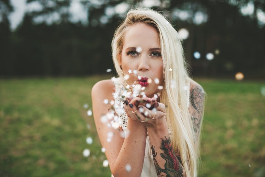 happy woman field flowers portrait