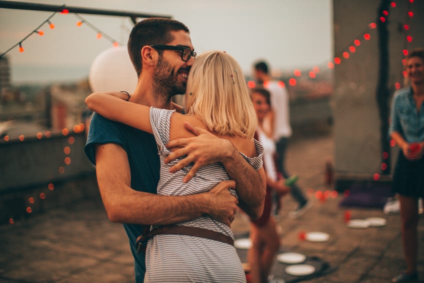 Couple embrace rooftop