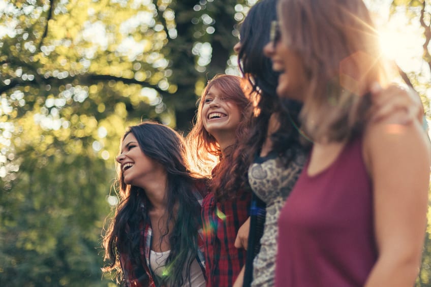 Group of teenage girls on a leisure walk in the city park