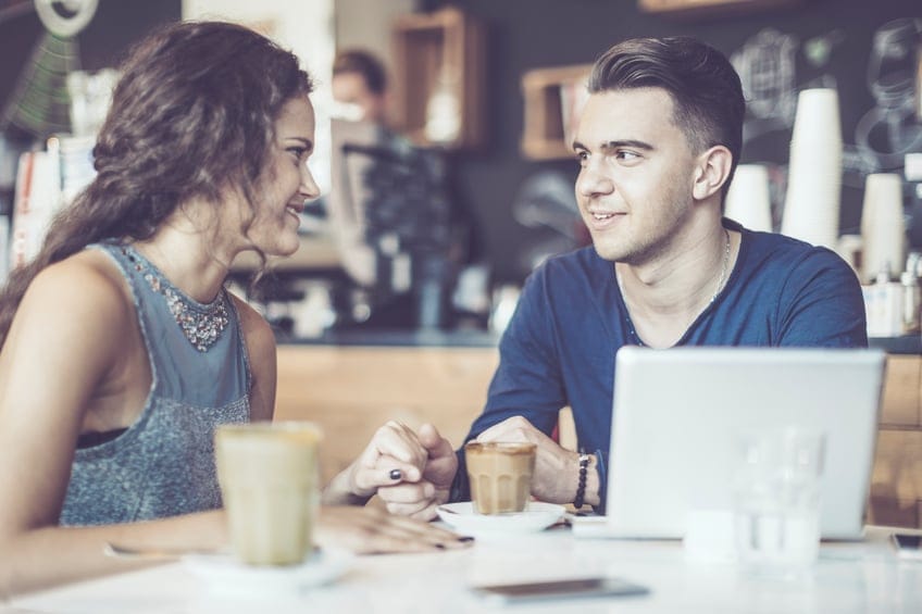 Beautiful young couple is texting together