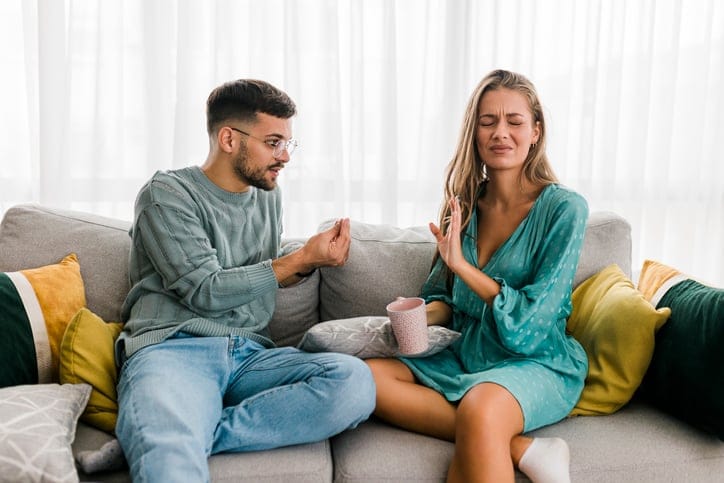 couple in argument on couch