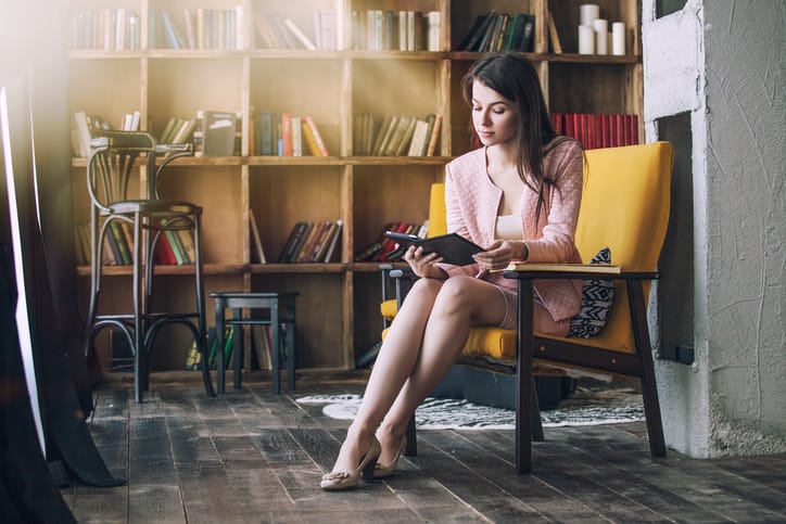 young woman reading library professional