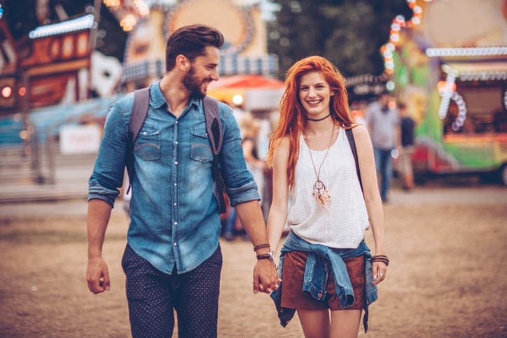 couple happy outdoors festival date romance