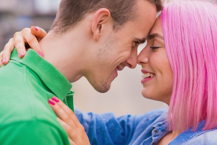 Couple embracing one another.