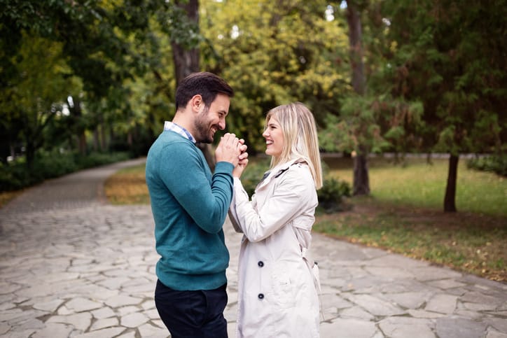 Loving happy couple hugging in park