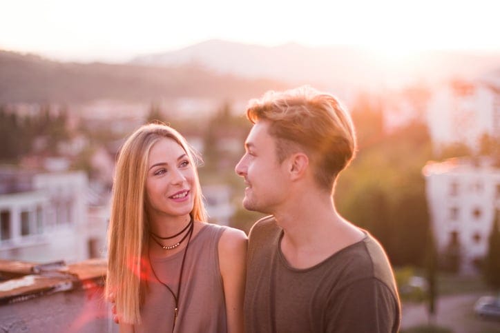 young couple outdoors sun romance love