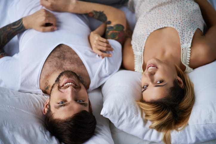 couple happy bed romance home comfort