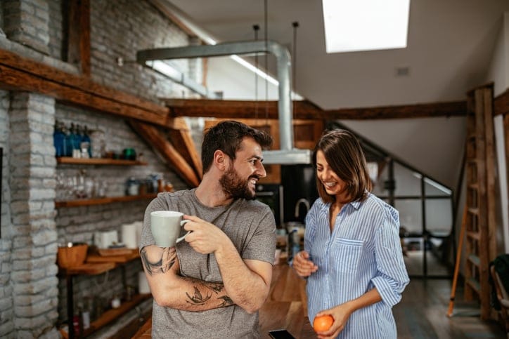 Woman and man having coffee.