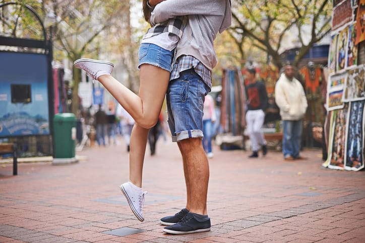 couple's legs in romantic embrace