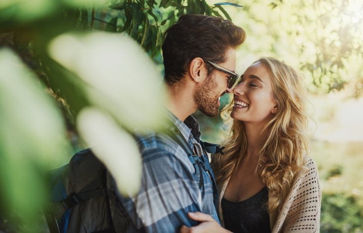 Shot of a happy young couple spending time together in nature