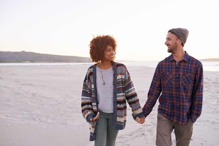 Couple on a walk on the beach.