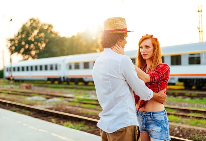 Romantic couple outdoors near train