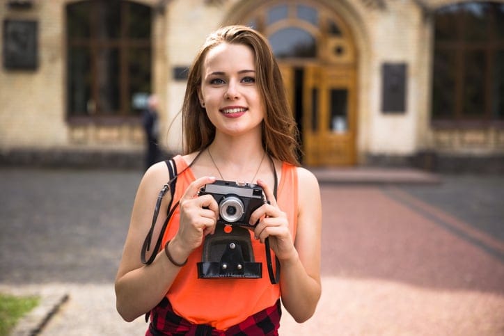young woman happy camera travel